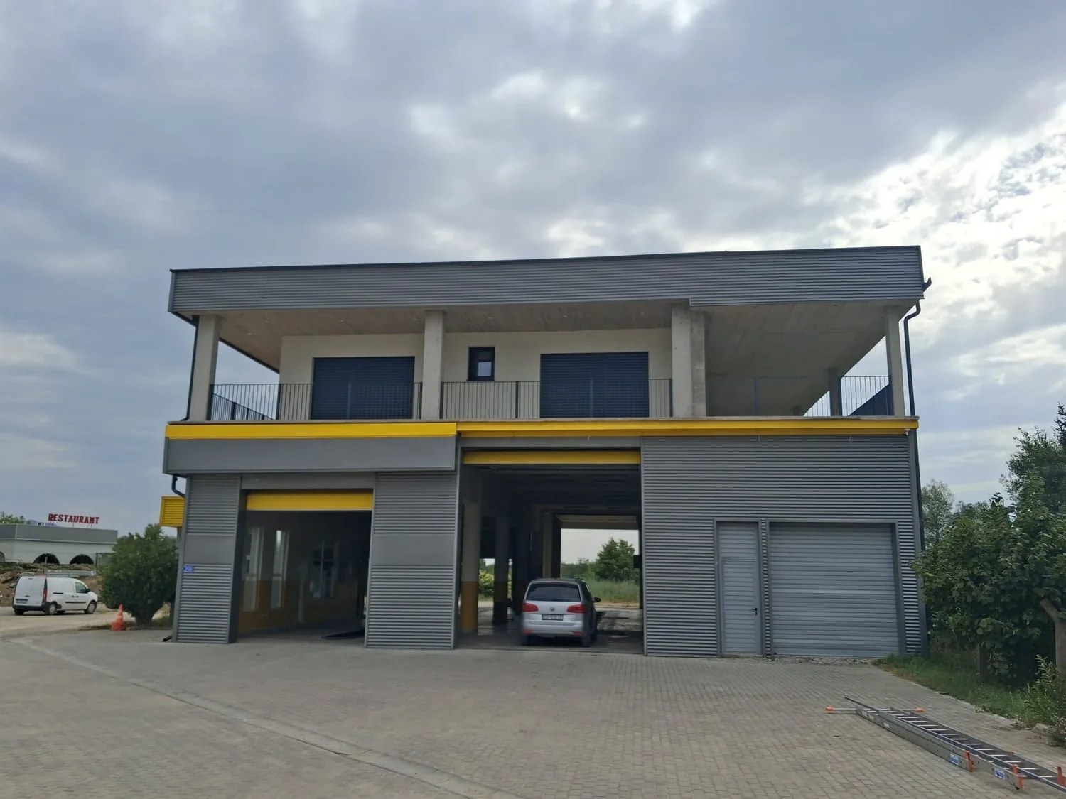 A building with a completed steel structure and façade.